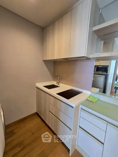 Modern kitchen with sleek cabinetry and built-in appliances