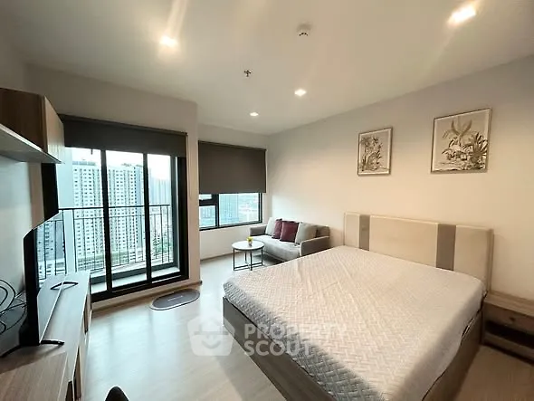 Modern bedroom with city view and cozy decor in high-rise apartment