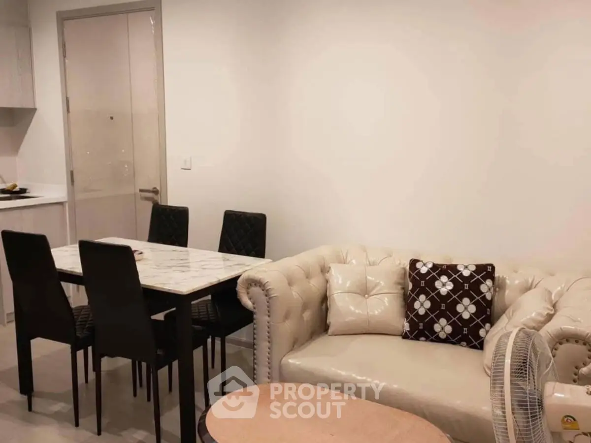 Chic modern living room with elegant sofa and dining area