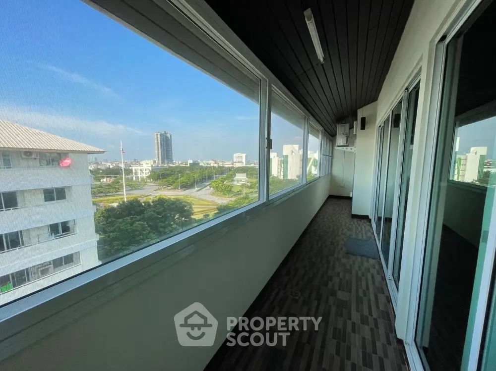 Spacious balcony with panoramic city view in modern apartment