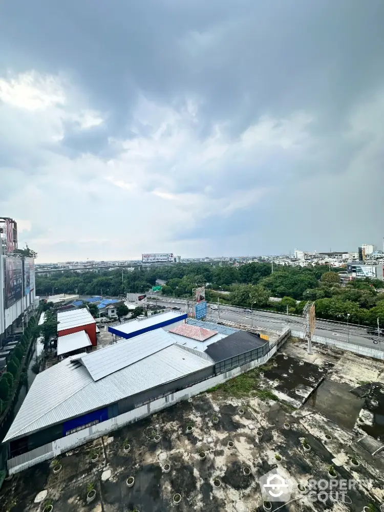 Stunning aerial view of urban landscape with lush greenery and expansive skyline.