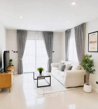 Bright and modern living room with stylish decor and natural light.