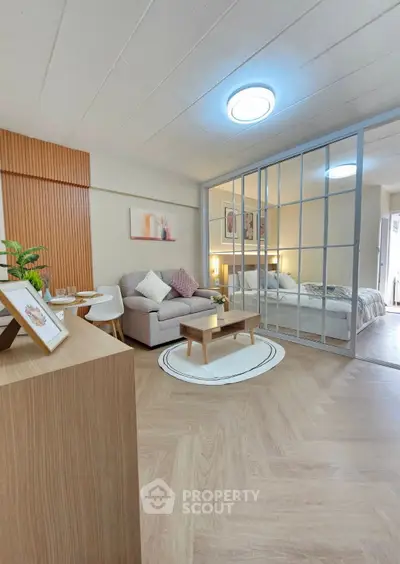 Modern open-plan living room with cozy bedroom divider and stylish decor