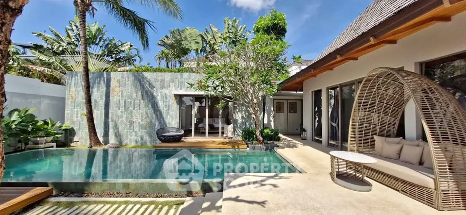 Luxurious tropical villa with private pool and lush garden, perfect for serene living.