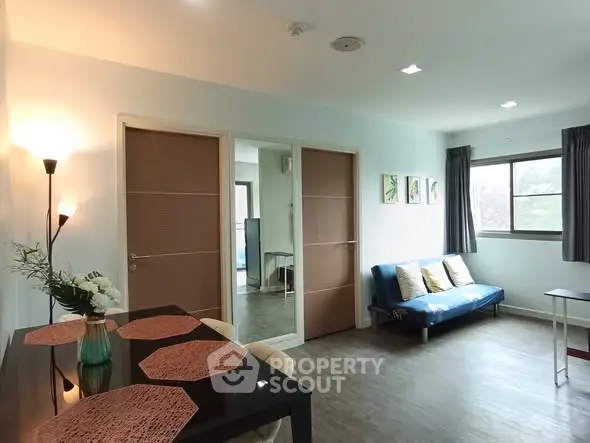 Spacious living room with modern decor and natural light