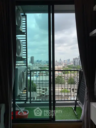 Stunning city view from a modern balcony with air conditioning units.