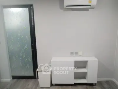 Modern minimalist interior with air conditioning and frosted glass door