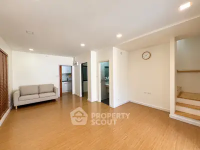Spacious living room with wooden flooring and modern design