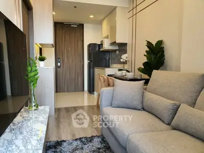 Modern living room with cozy sofa and stylish decor in a compact apartment