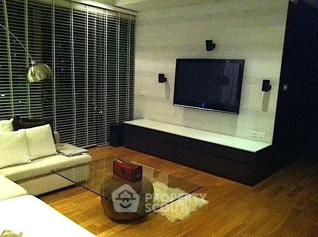 Modern living room with sleek TV setup and stylish furniture