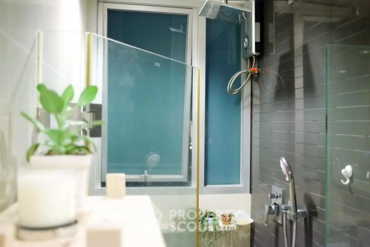 Modern bathroom with glass shower and sleek fixtures