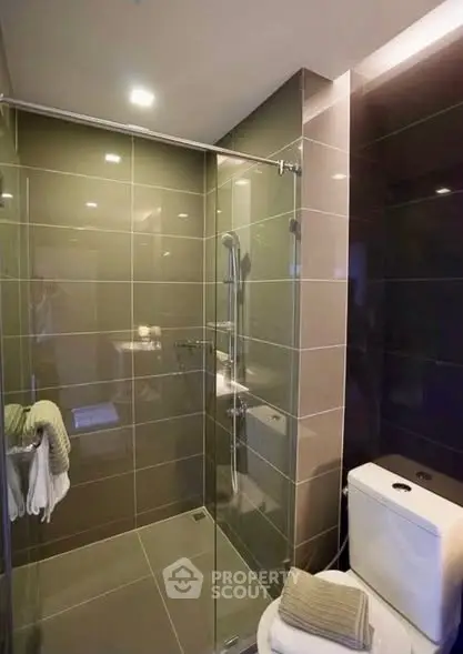 Modern bathroom with glass shower and sleek tile design