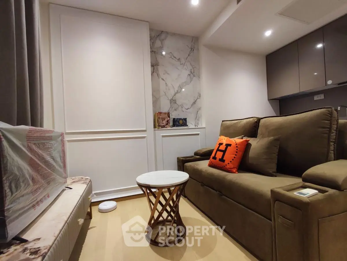 Cozy living room with modern decor and stylish furniture in a contemporary apartment.