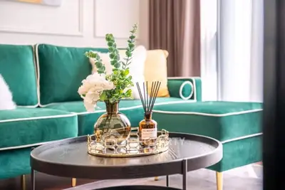 Luxurious living room with green velvet sofa and elegant decor
