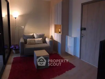 Cozy living room with modern decor and warm lighting, perfect for relaxation.
