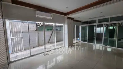 Spacious corner unit with large windows and tiled flooring, perfect for natural light lovers.