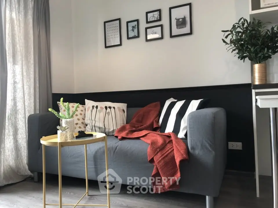 Stylish living room with modern decor, cozy sofa, and elegant wall art, perfect for urban living.