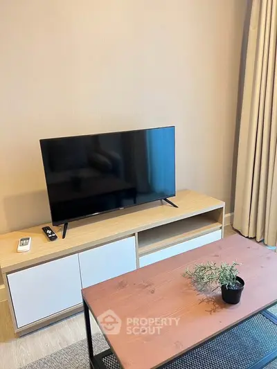 Modern living room with sleek TV setup and stylish furniture