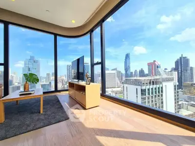 Stunning corner unit living room with panoramic city views and modern decor.