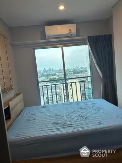 Modern bedroom with city view and air conditioning in high-rise apartment