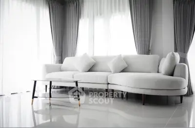Elegant modern living room with stylish white sofa and chic curtains