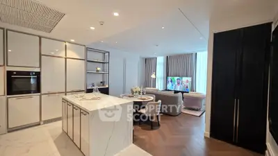 Luxurious open-plan kitchen and living room with modern design and elegant finishes.