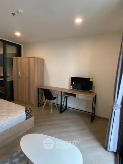 Modern bedroom with sleek furniture and natural light