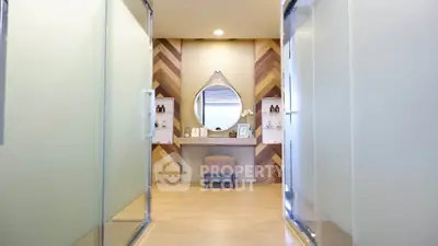 Modern bathroom with stylish wooden accents and elegant vanity mirror
