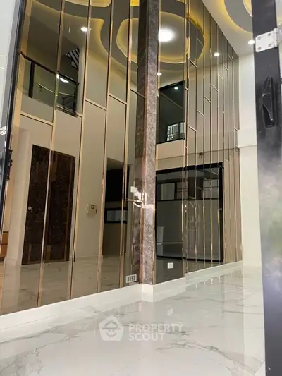 Luxurious modern interior with high ceilings and elegant design elements.