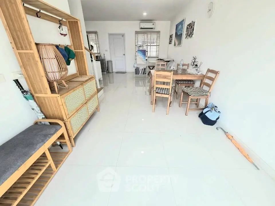 Spacious and bright living room with modern furniture and dining area, perfect for family gatherings.