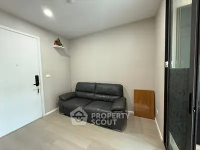 Cozy living room with modern leather sofa and minimalist decor