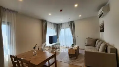 Spacious living room with modern decor and natural light