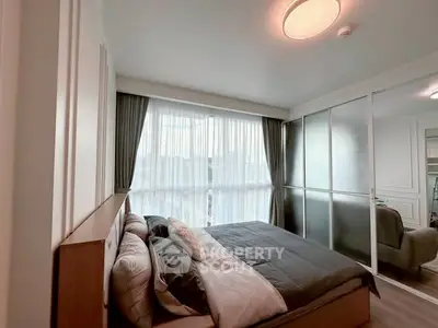 Modern bedroom with large window and stylish decor