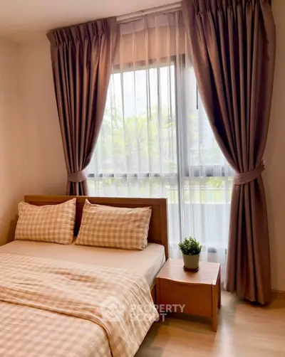 Cozy bedroom with elegant curtains and a wooden bed frame, perfect for relaxation and comfort.
