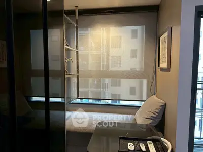 Cozy study nook with modern decor and large window in urban apartment