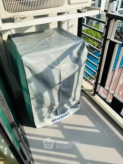 Charming balcony with Samsung appliance cover, perfect for urban living.