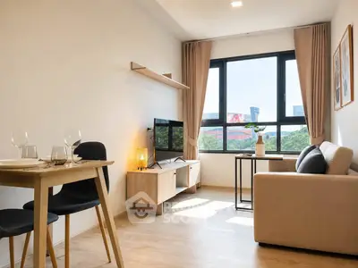 Modern living room with large window, cozy sofa, and dining area in a bright apartment.