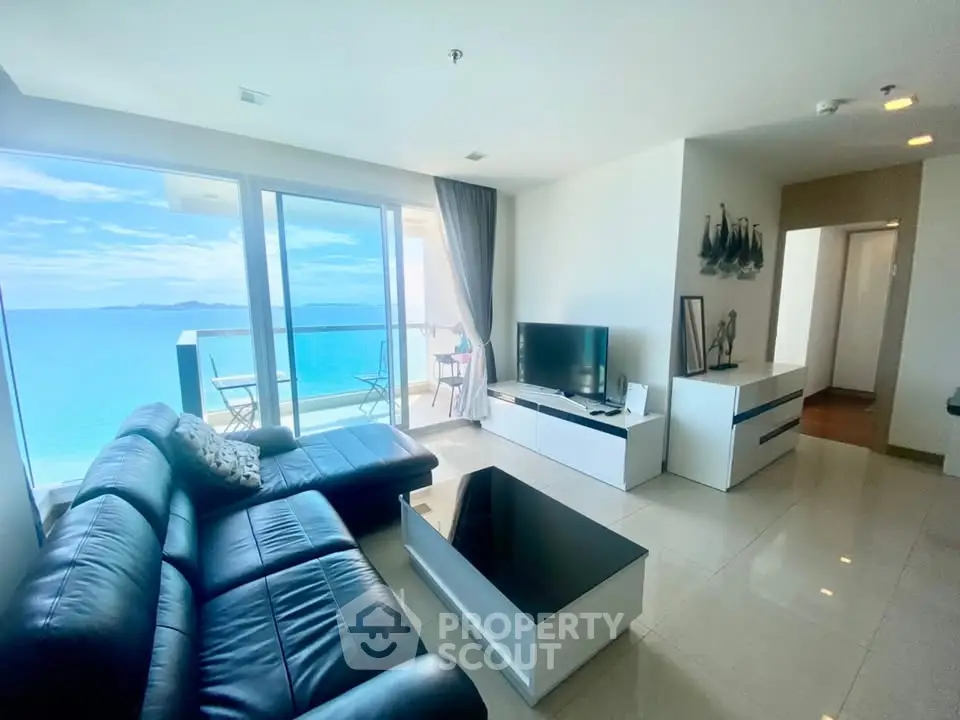 Stunning ocean-view living room with modern furnishings and large balcony.