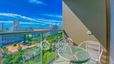 Stunning balcony view with cityscape and lush greenery, perfect for relaxation and enjoying the skyline.