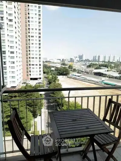 Spacious balcony with city view in modern high-rise apartment