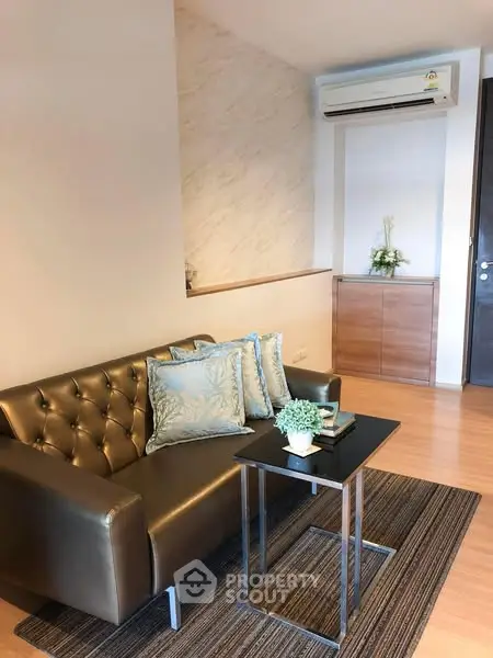 Modern living room with elegant sofa and air conditioning
