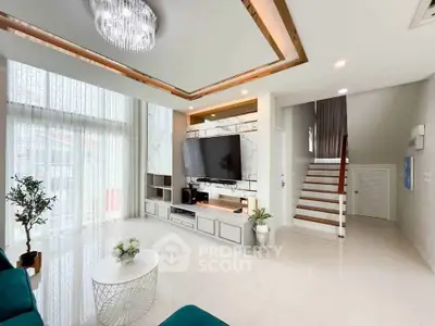 Spacious modern living room with high ceilings and elegant decor