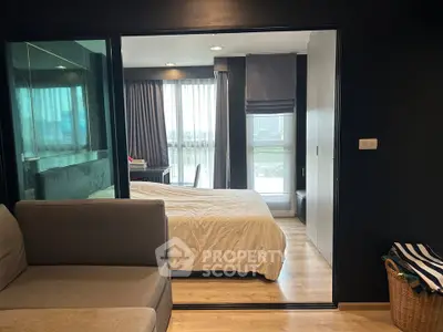 Modern apartment interior with cozy bedroom and stylish living area, featuring large windows and elegant decor.