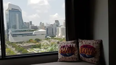 Stunning cityscape view from a modern apartment window with stylish decor.