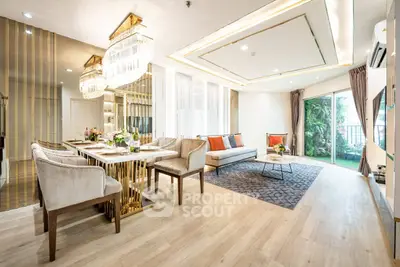Luxurious living room with elegant decor and spacious layout, featuring a stylish dining area and large windows.