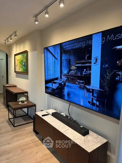 Stylish modern living room with wall-mounted TV and elegant decor