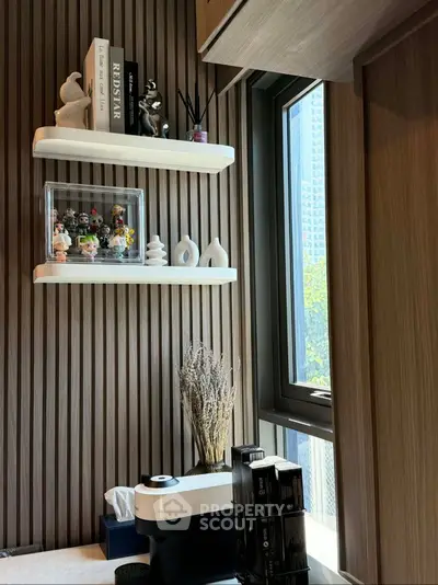 Stylish study nook with modern shelving and window view