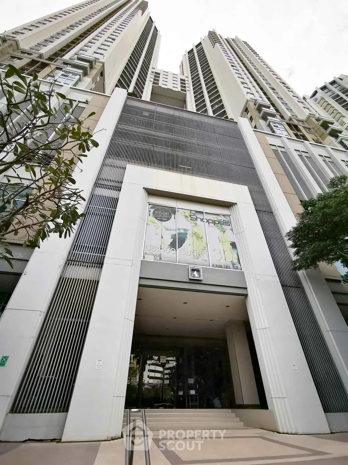 Stunning modern high-rise building entrance with sleek architectural design.
