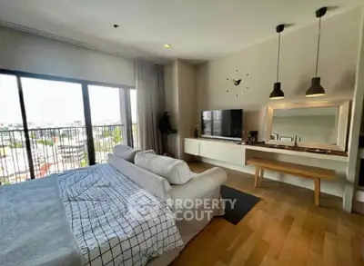 Spacious modern living room with large windows and stylish decor
