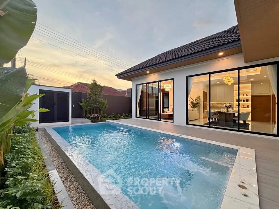 Luxurious modern home with private pool and elegant interior design, perfect for relaxation and entertaining.